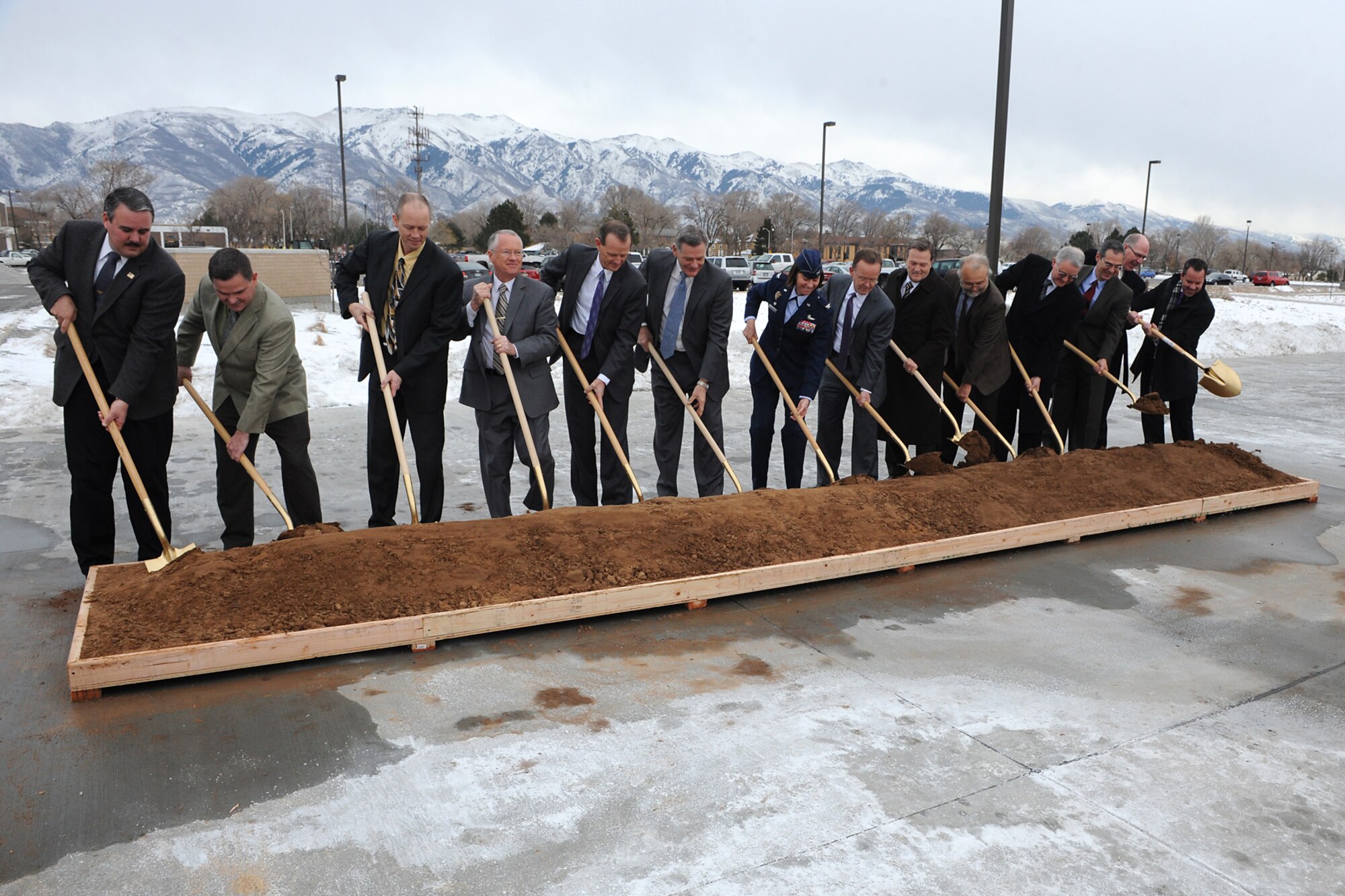 State and local leaders, along with base and Air Force leadership, use shovels to dig into soil set up for an official groundbreaking for the next building to begin construction in the Falcon Hill National Aerospace Research Park at Hill Air Force Base Jan. 18. (Left to right) They include: Rep. Lee Perry (R-Perry), Chief of Real Property Management Portfolio Air Force Real Property Agency John Busca, Falcon Hill Enhanced Use Lease Program Manager Darrin Wray, Clearfield Mayor Don Wood, Rep. Brad Dee (R-Ogden), Sen. Scott Jenkins (R-Weber), 75th Air Base Wing commander Col. Sarah Zabel, Sen. Stuart Adams (R-Weber), Sen. Jerry Stevenson (R-Davis), Woodbury Corp. vice president of Developement Jeff Woodbury, Woodbury corporate secretary and VP of Commericial Management Randy Woodbury, Hunt Senior VP Juan Gonzalez-Garza, Rep. Steve Handy (R-Layton) and Rep. Brad Wilson (R-Kaysville).  (U.S. Air Force photo by: Alex Llyod)