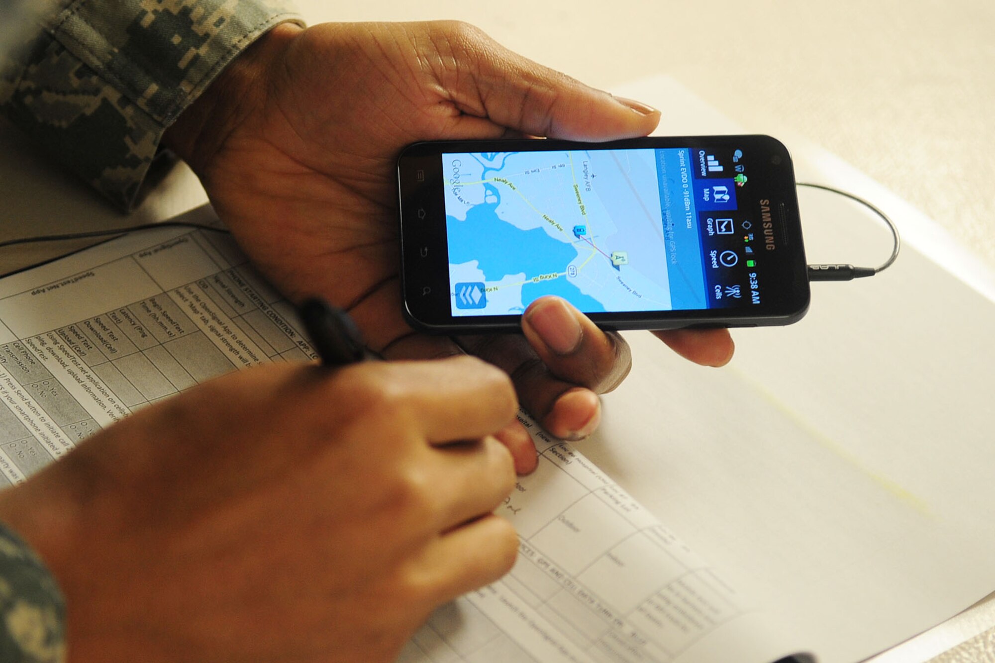 U.S. Staff Sgt. Oris Key, 633rd Security Forces Squadron patrolman, reads a checklist during a Joint Expeditionary Force Experiment exercise at Langley Air Force Base, Va., Jan. 25, 2012. The Air Force will use the information from the exercise to unify communication capabilities, and reduce the number of radio and wired local area networks. (U.S. Air Force photo by Staff Sgt. Ashley Hawkins/Released)