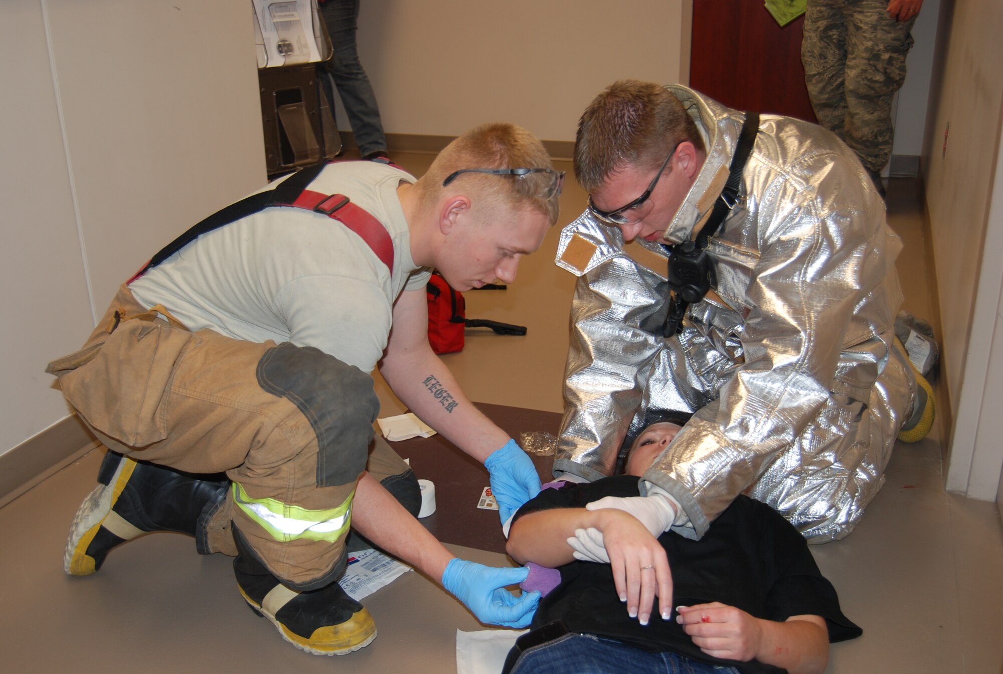 PETERSON AIR FORCE BASE, Colo. — Members of the Peterson Fire Department treat a victim during an active shooter exercise, Jan. 25. The purpose of the exercise was to evaluate and ensure preparedness of all Airmen in case of a real-world event. (U.S. Air Force photo/Lea Johnson)