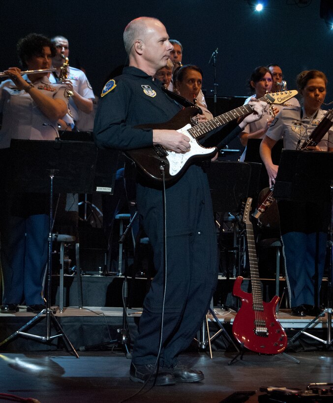 Master Sgt. Stephen Brannen plays guitar during an Air Force Academy Band performance in the Arnold Hall Theater Jan. 26, 2012. The performance was part of a 45-minute resiliency day presentation at the Academy. Brannen is the NCO in charge of the Academy Band's Wild Blue Country ensemble. (U.S. Air Force photo/Don Branum)