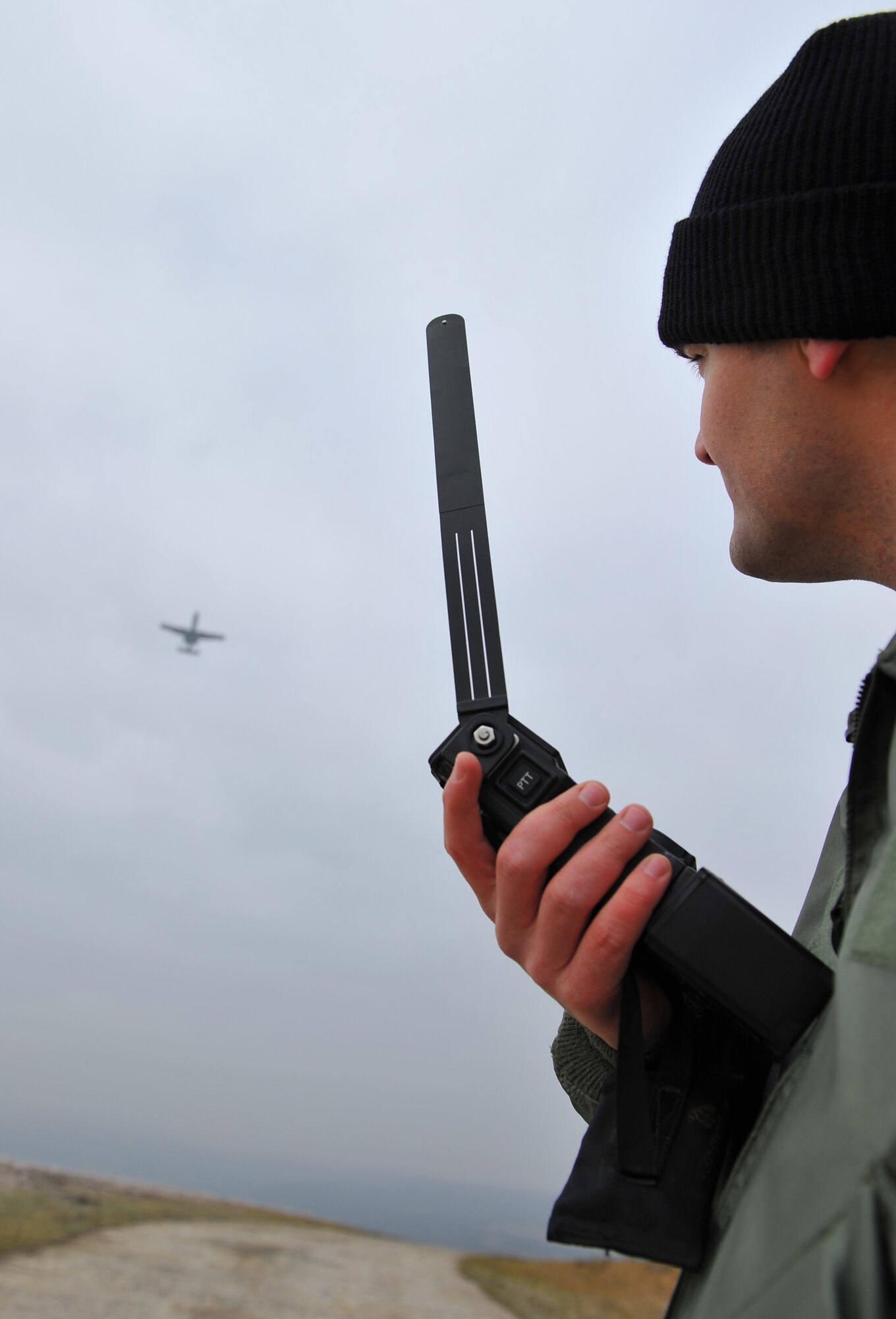 BAUMHOLDER, Germany – U.S. Air Force 1st Lt. Bob Carpenter, 81st Fighter Squadron pilot, uses a combat survivor evader locater radio to communicate with U.S. Air Force A-10 Thunderbolt II pilots during a U.S. Army and Air Force close air support and combat search and rescue training exercise at the Baumholder Major Training Area here Jan. 26. He relayed this information as the A-10s practiced CAS in an enemy threat scenario. The goal of this training is to develop tactics, techniques and procedures between the military branches to enhance interoperability. (U.S. Air Force photo/ Senior Airman Natasha Stannard)