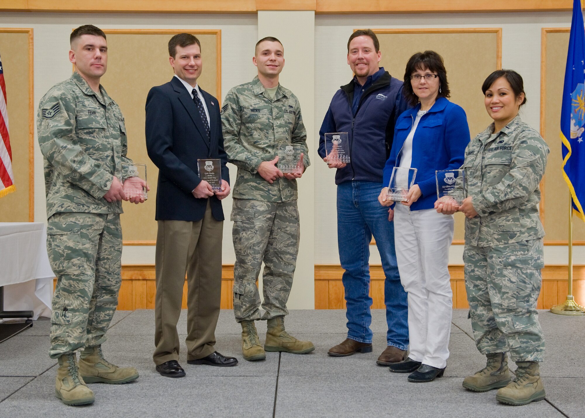 Team Malmstrom recognized winners of the 4th Quarterly Awards at a breakfast at the Grizzly Bend Jan. 24. Pictures from left to right are newly promoted Staff Sgt. Richard Frank, Airman of the Quarter; Kevin Younkin, Civilian Category I Supervisor of the Quarter; Senior Airman John Hicks, Honor Guard of the Quarter; Cindy O'Connell, Civilian Category II Supervisor of the Quarter; and 1st Lt. Olivia O'Campo, Company Grade Officer of the Quarter. Other winners, not pictured, are Jennifer Geike, Civilian Category I of the Quarter; Master Sgt. James Long, Senior NCO of the Quarter; Staff Sgt. Alma Torres, NCO of the Quarter; and the Antiterrorism Office, Team of the Quarter. (U.S. Air Force photo/Beau Wade)