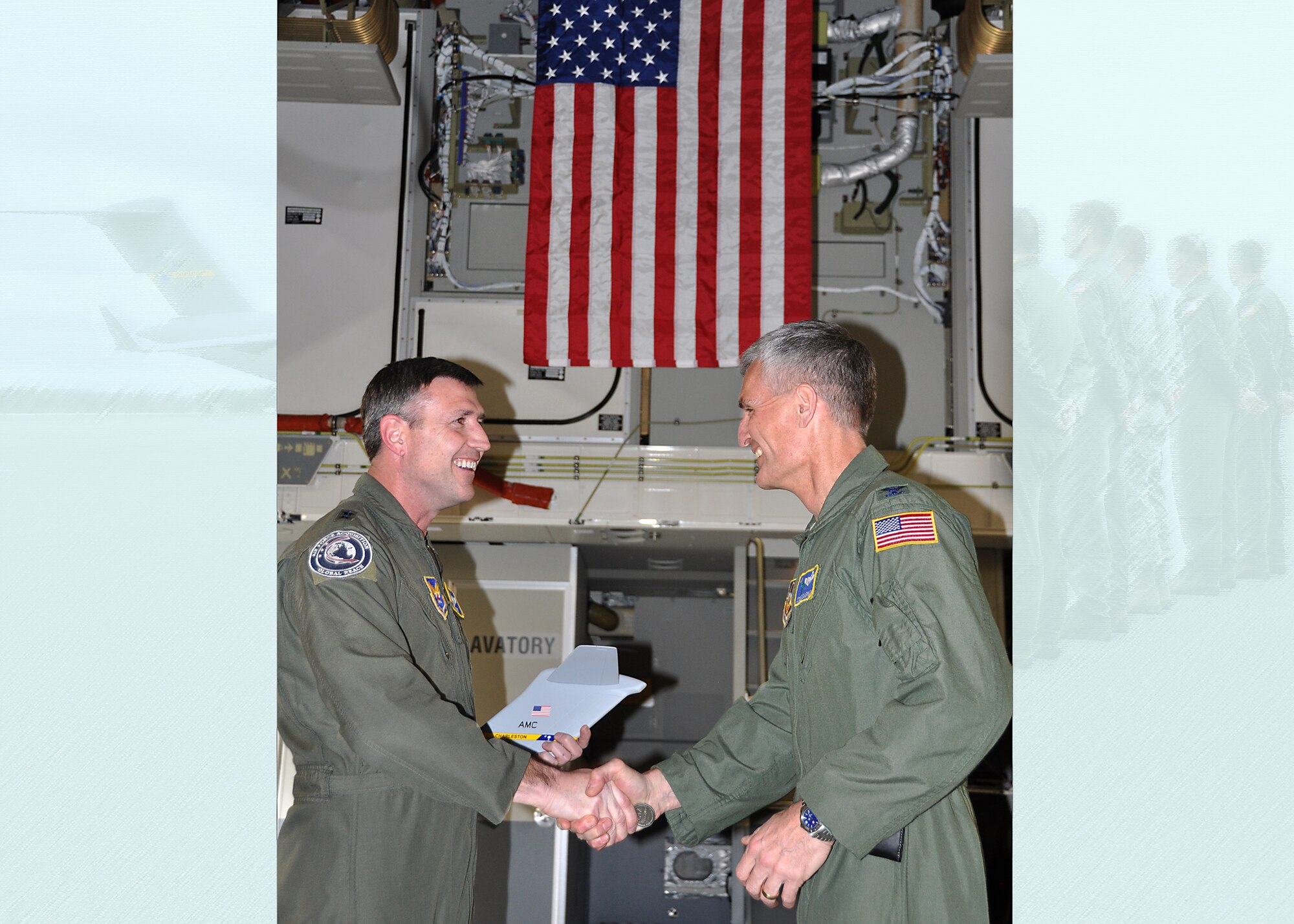 The 315th Airlift Wing at Joint Base Charleston received the latest C-17 to the base’s fleet January 26. Here, Col. Steven Chapman, 315AW commander presents a commemorative "T-tail" plaque to Maj. Gen. Robert C. Kane, director of Global Reach Programs. (U.S. Air Force photo by 1st Lt. Joe Simms)