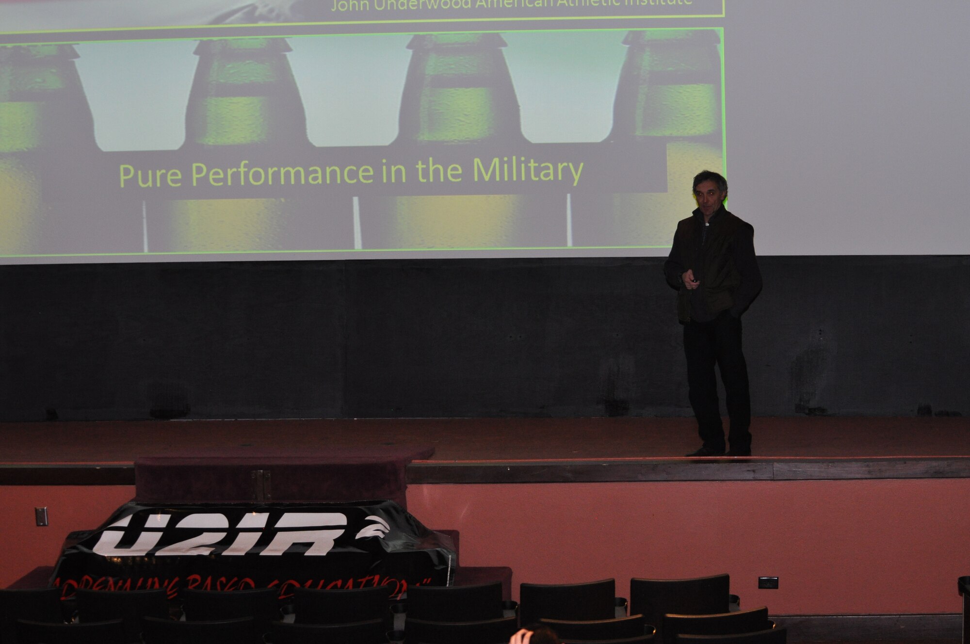 John Underwood, director of the American Athletic Institute, gives his “Pure Performance” presentation to Airmen here in the base theater Jan. 20. Underwood came to Warren as part of the Under 21 Responsible and Resilient program. (U.S. Air Force photo by 2nd Lt. Stacey Fenton)