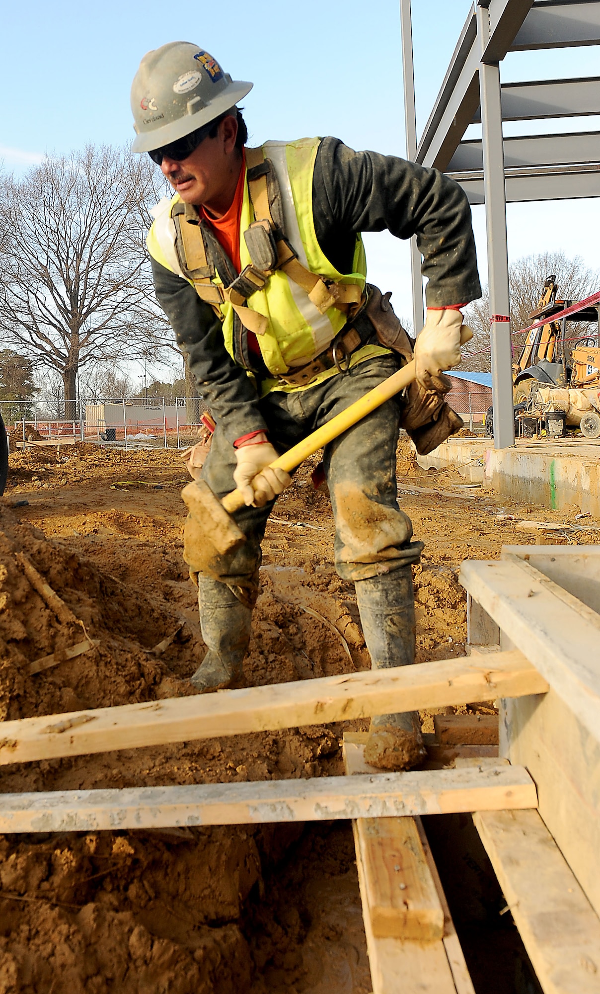 Jose Mendoza, carpenter, braces for the concrete form work at the new AIT dining facility site at Fort Eustis, Va., Jan. 24, 2012. The AIT dining facility is part of the AIT Phase I project which is scheduled to be completed in the fall. (U.S. Air Force photo by Staff Sgt. Antoinette Gibson/Released)