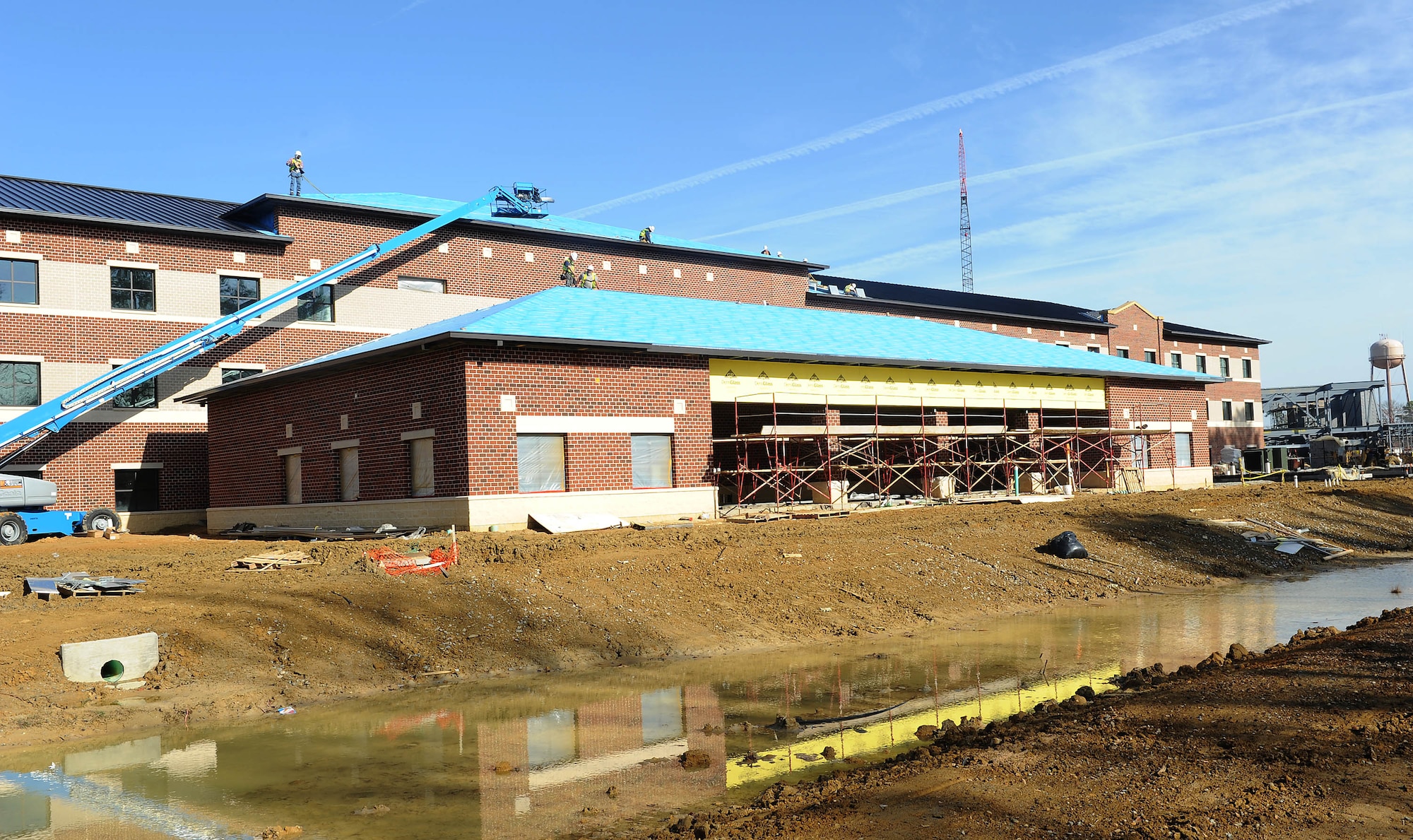 Balfour Beatty construction teams labor to finish the new AIT-Phase 1 barracks located on Marshall Street at Fort Eustis, Va., Jan. 24, 2012. This facility is part of a four part phase project to add new AIT barracks and a dining facility on post. (U.S. Air Force photo by Staff Sgt. Antoinette Gibson/Released)