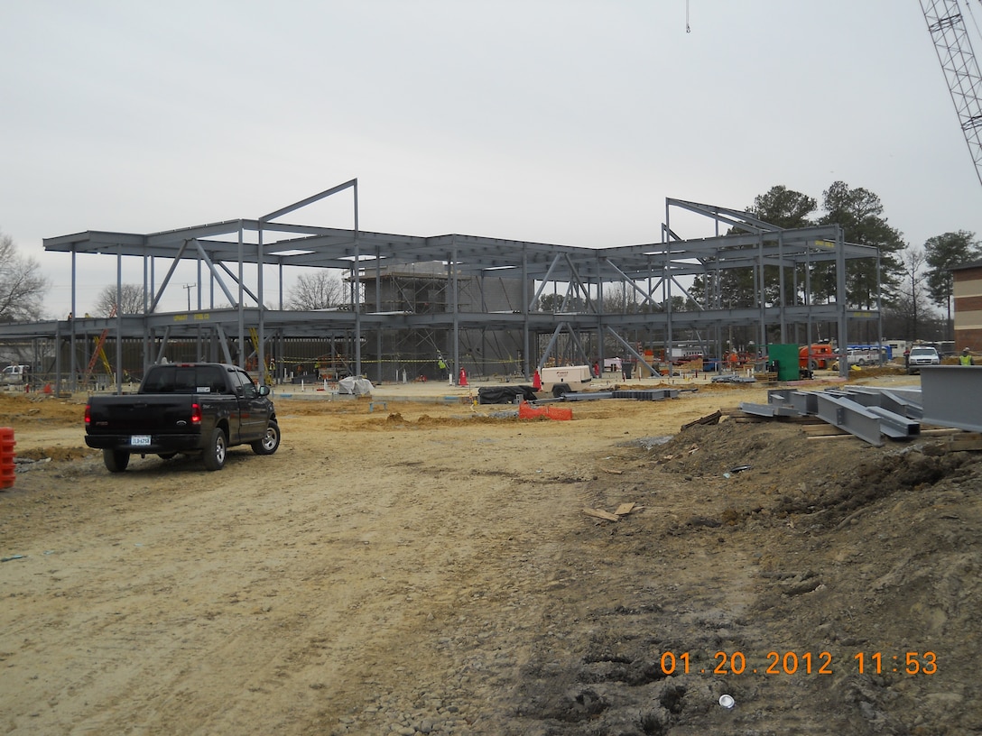 Construction workers execute plans for a new AIT dining facility on the corner of Jackson Avenue and Madison Ave at Fort Eustis, Va., Jan. 24, 2012. The new dining facility scheduled to open this fall with a feeding capacity of up to 2,600 soldiers. (Courtesy Photo by Stephen Duncan/Released)