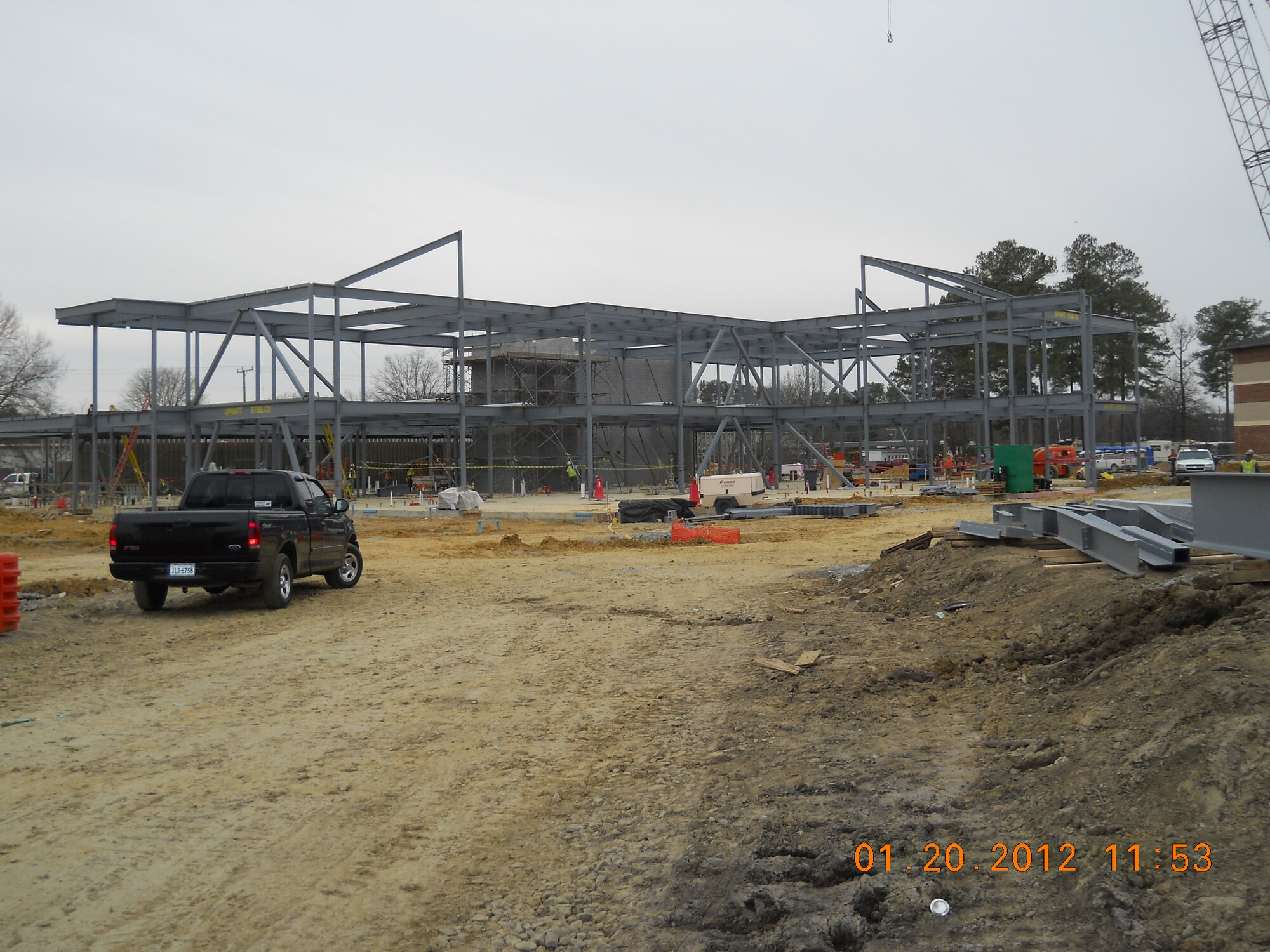 Construction workers execute plans for a new AIT dining facility on the corner of Jackson Avenue and Madison Ave at Fort Eustis, Va., Jan. 24, 2012. The new dining facility scheduled to open this fall with a feeding capacity of up to 2,600 soldiers. (Courtesy Photo by Stephen Duncan/Released)