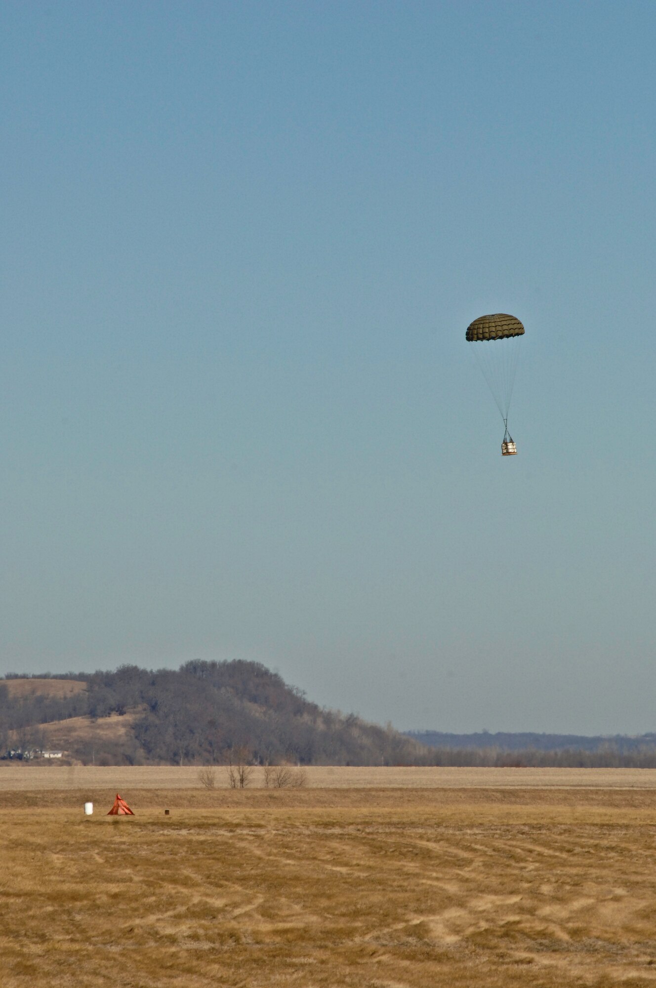 An Improved Container Delivery System falls toward the point of impact near Rosecrans Air National Guard Base, St. Joseph, Mo., Jan. 26, 2012. The airdrop was part of the Advanced Airlift Tactics Training Center’s 30th Annual Tactics and Intelligence Symposium. (Missouri Air National Guard photo by Tech. Sgt. Erin Hickok)