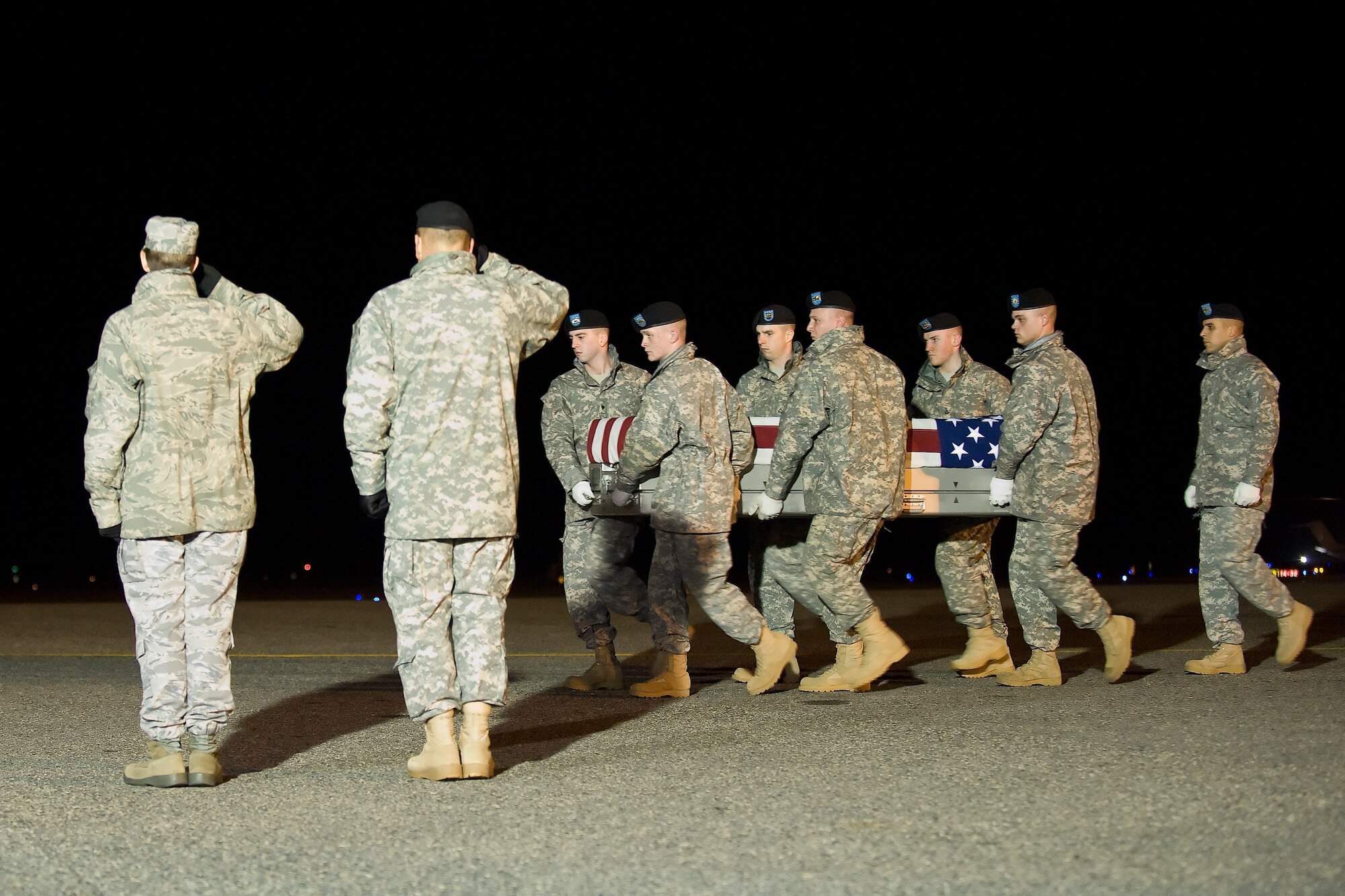 A U.S. Army carry team transfers the remains of Army 1st Lt. David A. Johnson of Horicon, Wis., at Dover Air Force Base, Del., Jan. 26, 2012. Johnson was assigned to the 5th Battalion, 20th Infantry Regiment, 3rd Stryker Brigade Combat Team, 2nd Infantry Division, Joint Base Lewis-McChord, Wash. (U.S. Air Force photo/Adrian R. Rowan)
