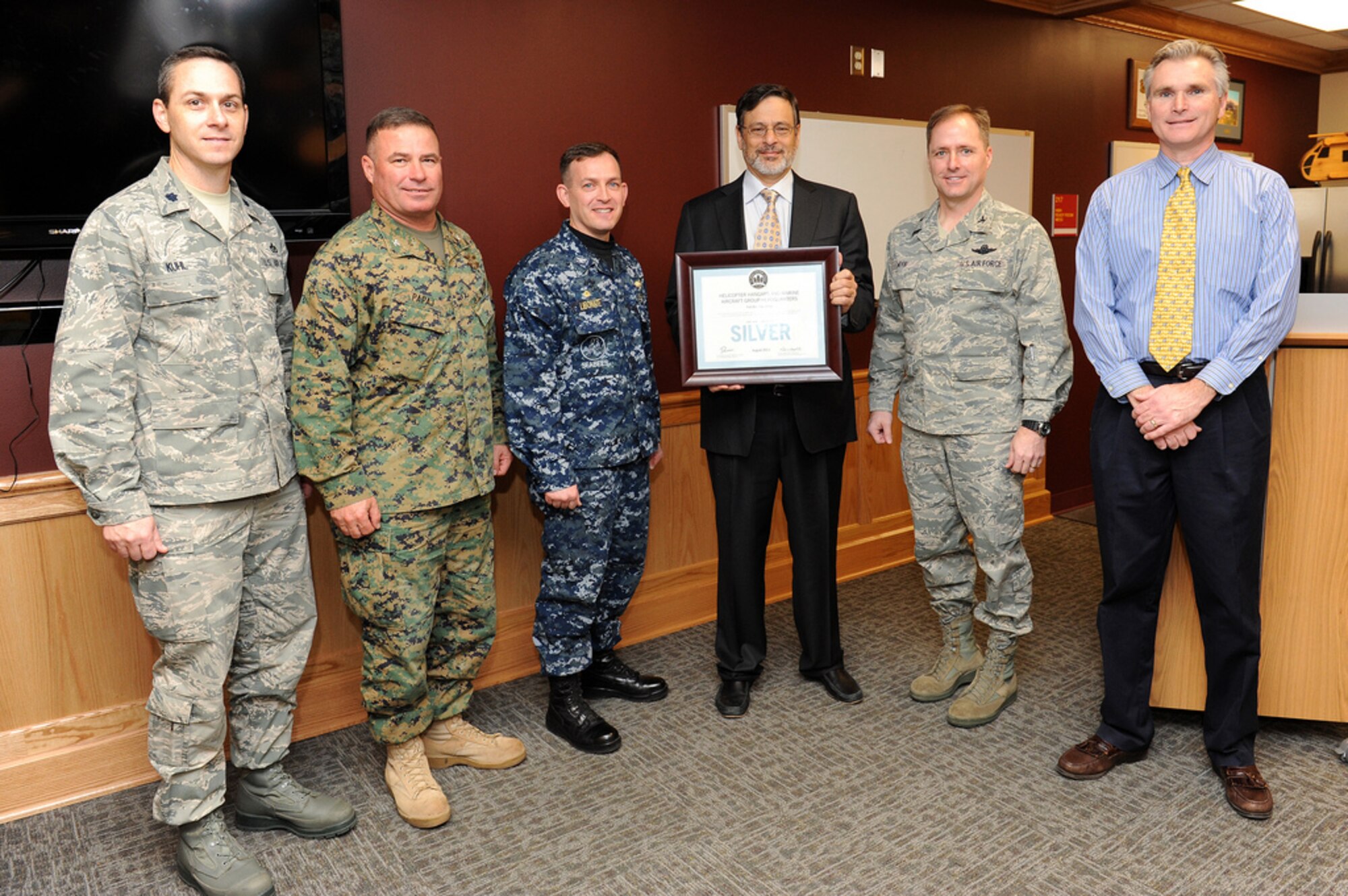 Joint Base McGuire-Dix-Lakehurst’s Marine Aircraft Group 49 received the Silver Leadership in Energy and Environmental Design Award Jan. 25 here. The unit and base leadership received the Silver LEED Award for achieving high performance in human and environmental health quality during the design and construction phases of Building 4401. (U.S. Air Force photo by Russ Meseroll/Released) 