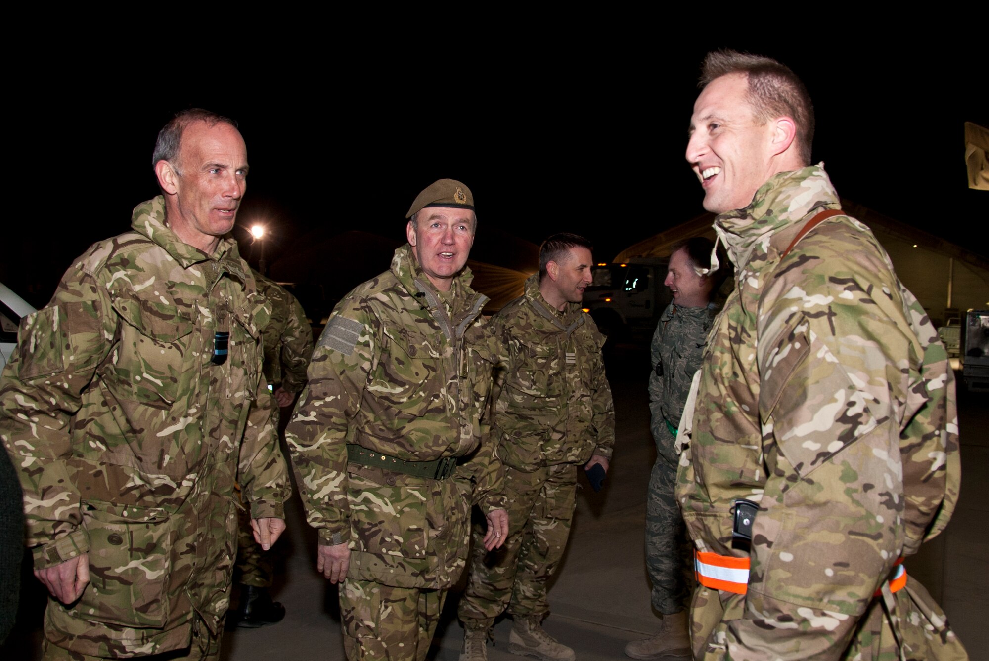 KANDAHAR AIRFIELD, Afghanistan -- From left, Royal air force Air Marshal Steve Hillier and Royal air force Gen. Nicholas Houghton, vice chief of defence staff, meets a member of the 62nd Expeditionary Reconnaissance Squadron during the general’s visit to the 62nd ERS Jan. 23, 2012. The general and members of his staff toured the unit to understand the mission of the Royal air force members who are embedded in the 62nd ERS. (U.S. Air Force photo by Staff Sgt. David Carbajal)