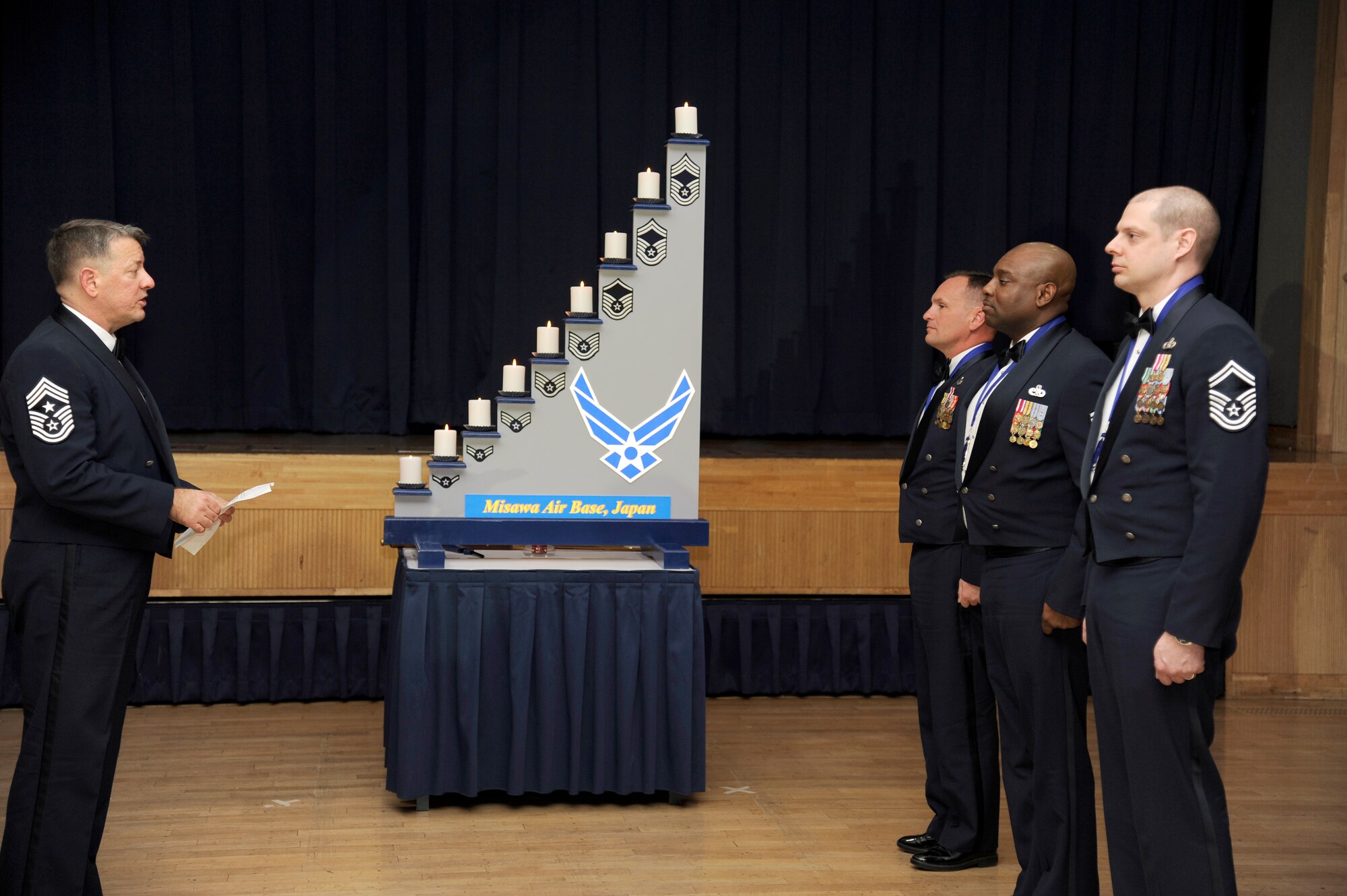 MISAWA AIR BASE, Japan - Chief Master Sgt. Russell Hastings, 35th Fighter Wing command chief, recites the charge of office to Misawa's newest chiefs during the Chief Recognition Ceremony here, Jan. 25. The rank of Chief Master Sergeant was established Dec. 1, 1959 and the individuals promoted on this date became known as the Charter Chiefs. (U.S. Air Force photo/Tech. Sgt. Marie Brown)
