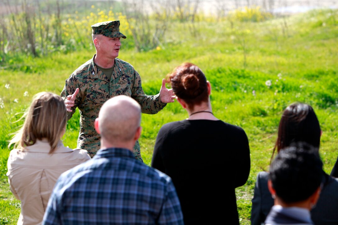 Colonel Scott D. Campbell, commanding officer, 15th Marine Expeditionary Unit, addresses local community business leaders at Camp Pendleton’s Red Beach training area during a VIP visit, Jan. 27. Campbell emphasized the importance of MEUs by discussing some of the accomplishments of recently deployed MEUs and the support the MEUs are capable of providing during a crisis. “We’re America’s away team,” he said. He also talked about the role of the Navy and Camp Pendleton’s part in offering a training environment for his unit. The 15th MEU is currently training for a deployment scheduled for this fall. (U.S. Marine Corps photo by Cpl. John Robbart III)