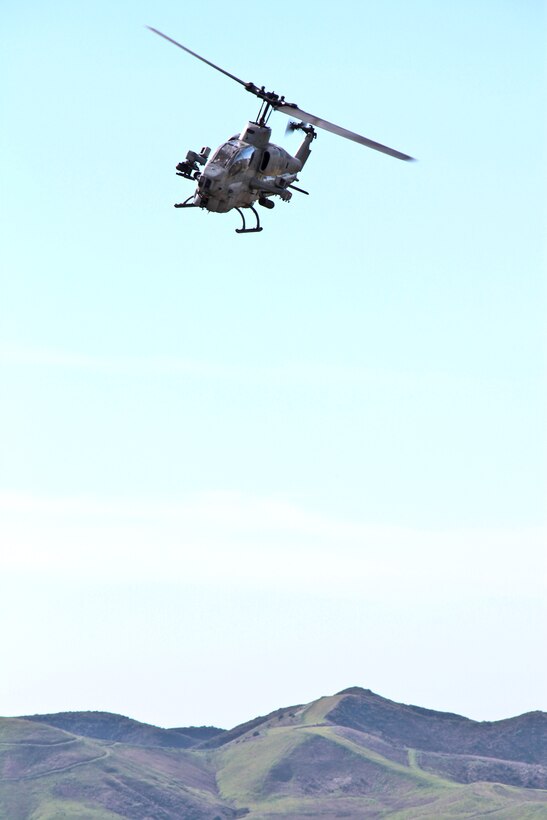 An AH-1Z Super Cobra flies over an impact zone during a close air support exercise aboard Camp Pendleton, Calif., Jan. 27. The training event was part of Exercise Iron Fist 2012, a bilateral training exercise between the 15th Marine Expeditionary Unit and the Japanese Ground Self Defense Force.