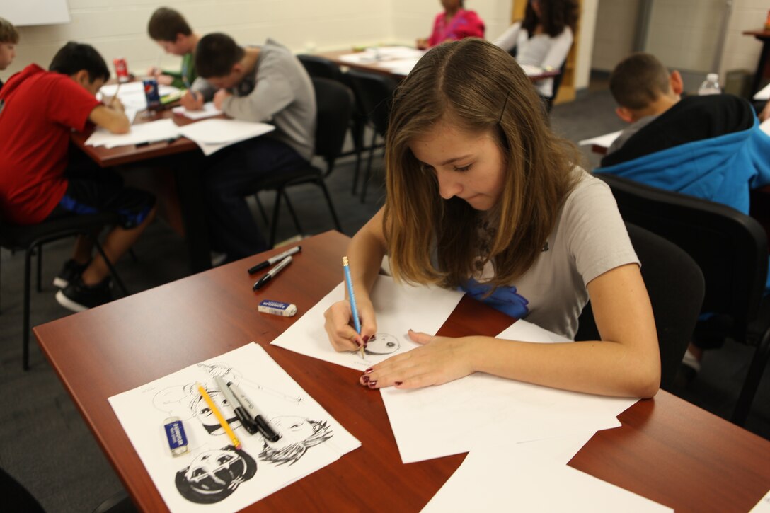 A teen draws manga during Marine Corps Base Camp Lejeune Libraries’ Teen Manga Art Class Jan 28 at the Harriotte B. Smith Library. The class is taught by artist Jana Guitar.