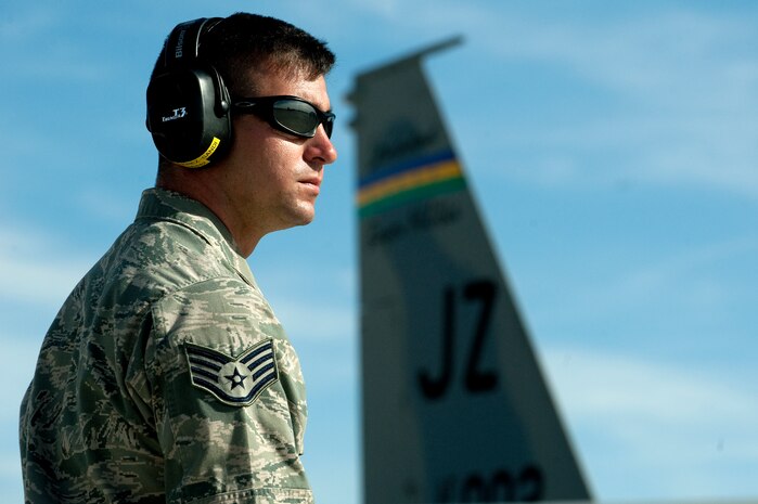 A U.S. Air Force Airman, 159th Fighter Wing, Louisiana Air National Guard, watches an F-15E Strike Eagle taxi down the ramp during Red Flag 12-2 Jan. 24, 2012, at Nellis Air Force Base, Nev. Red Flag is a realistic combat training exercise involving the air forces of the United States and its allies. The exercise is hosted north of Las Vegas on the Nevada Test and Training Range. (U.S. Air Force photo by Staff Sgt. Christopher Hubenthal) 
