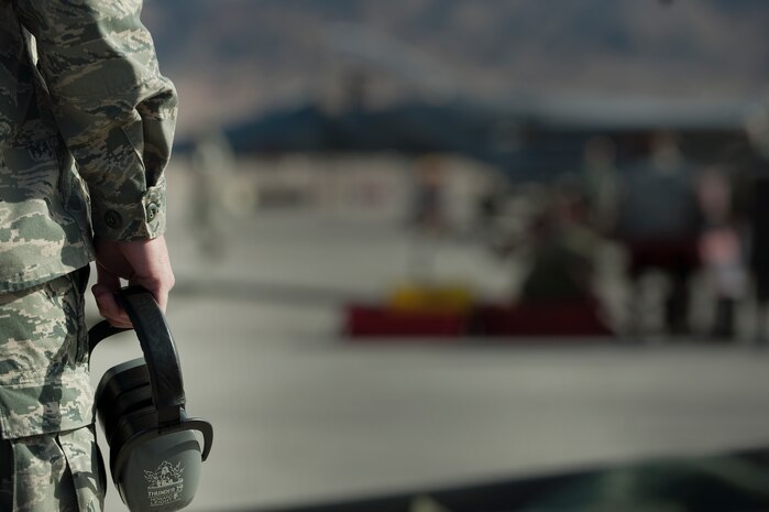A U.S. Air Force Airman, 104th Fighter Wing, Massachusetts Air National Guard, prepares for F-15E Strike Eagles to return from a training mission during Red Flag 12-2 Jan. 27, 2012, at Nellis Air Force Base, Nev. Red Flag is a realistic combat training exercise involving the air forces of the United States and its allies. The exercise includes units from Nevada, Colorado, South Dakota, Louisiana, Utah, California, Republic of Korea, Kingdom of Saudi Arabia, Massachusetts and Oklahoma. (U.S. Air Force photo by Staff Sgt. Christopher Hubenthal) 