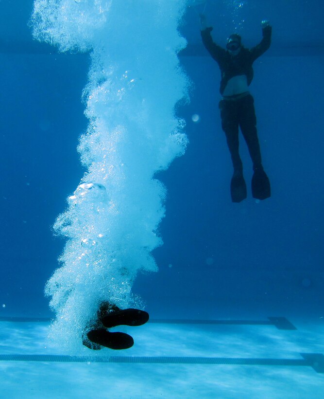 A Japanese soldier from the Japanese Ground Self Defense Force jumps into a pool during a helocast preparation exercise aboard Camp Pendleton, Calif., Jan. 28, 2011. The event was part of Exercise Iron Fist 2012, a bilateral amphibious training exercise between the 15th Marine Expeditionary Unit and the JGSDF.