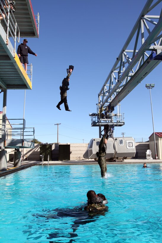 Japanese soldiers from the Japanese Ground Self Defense Force jumps into a pool, conducting casualty drills during a helocast preparation exercise aboard Camp Pendleton, Calif., Jan. 28, 2011. The event was part of Exercise Iron Fist 2012, a bilateral amphibious training exercise between the 15th Marine Expeditionary Unit and the JGSDF.