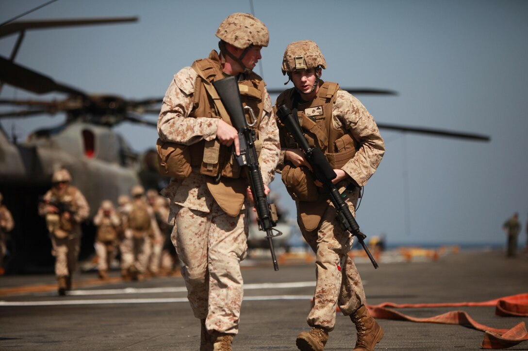 Marines with Combat Logistics Battalion 11 rush to establish a security perimeter during casualty-evacuation training aboard USS Makin Island Jan. 28. The battalion provides logistics and services to the 11th Marine Expeditionary Unit, which is currently deployed aboard the amphibious assault ship as part of the Makin Island Amphibious Ready Group, a U.S. Central Command theater reserve force. The group is providing support for maritime security operations and theater security cooperation efforts in the U.S. Navy's 5th Fleet area of responsibility.