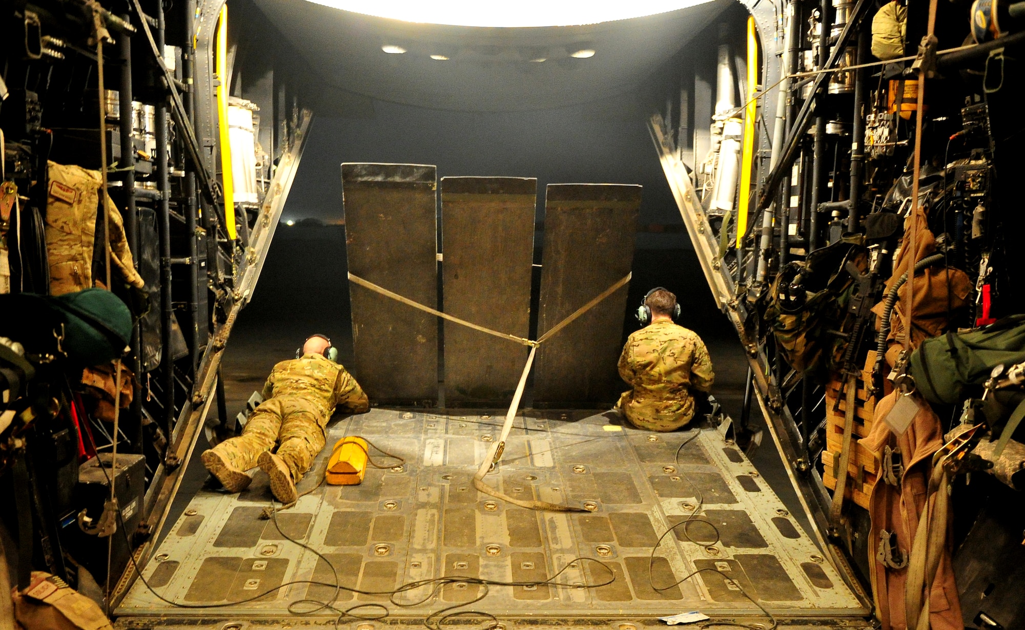 CAMP BASTION, Afghanistan – Airmen assigned to the 76th Expeditionary Rescue Squadron act as spotters from a HC-130 as it backs up to an ambulance after a medical evacuation. The 76th ERQS serves as an ambulance of the air for Operation ENDURING FREEDOM. The squadron’s mission is to provide medical or casualty evacuation and personnel recovery for U.S. and coalition forces, Afghan National Security Forces and local nationals in all of the regional commands in Afghanistan. (U.S. Air Force photo/Senior Airman Tyler Placie)