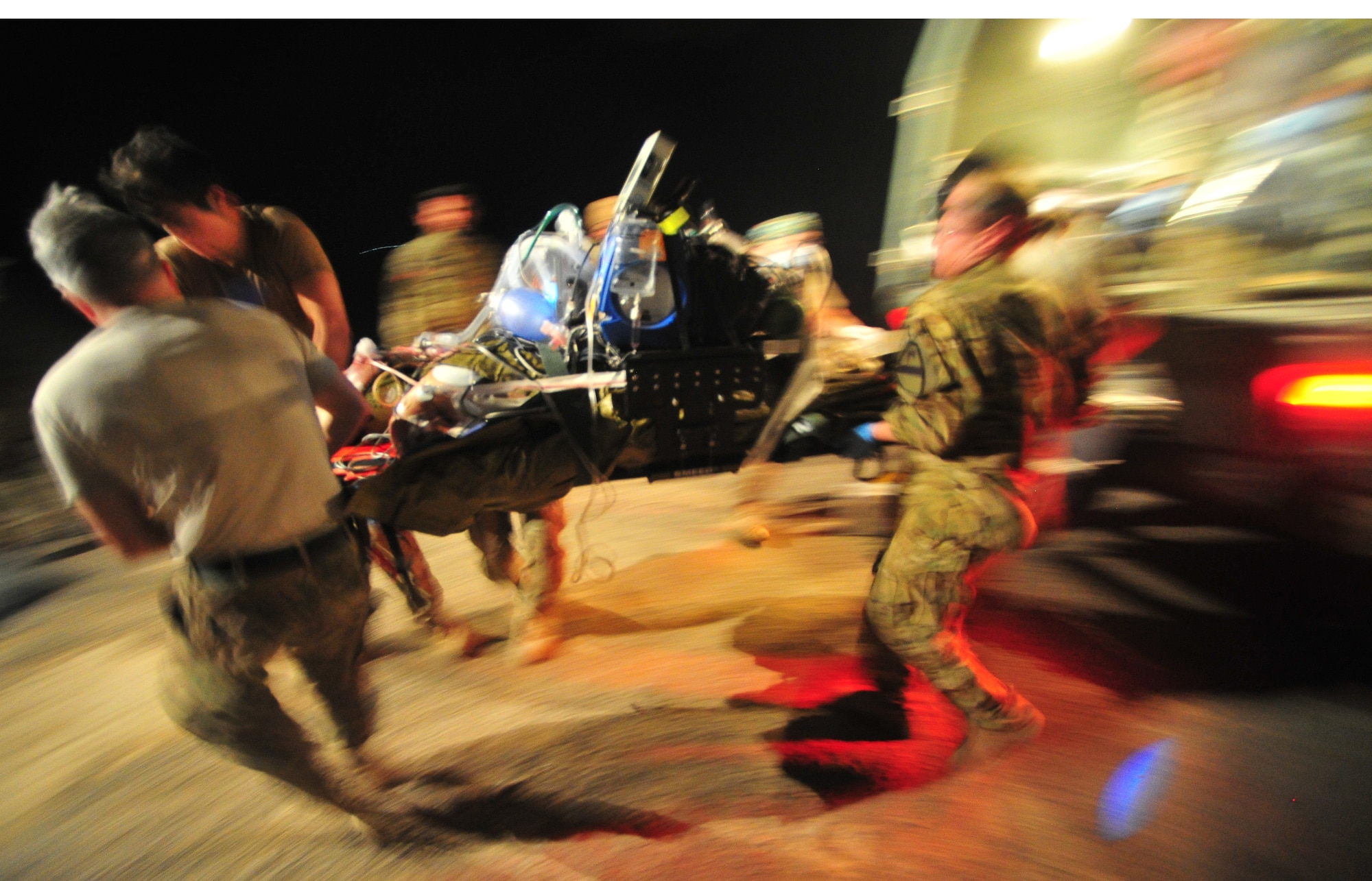 CAMP BASTION, Afghanistan – Airmen assigned to the 76th Expeditionary Rescue Squadron offload a patient by litter from an ambulance to a HC-130 for medical evacuation. The 76th ERQS serves as an ambulance of the air for Operation ENDURING FREEDOM. The squadron’s mission is to provide medical or casualty evacuation and personnel recovery for U.S. and coalition forces, Afghan National Security Forces and local nationals in all of the regional commands in Afghanistan. (U.S. Air Force photo/Senior Airman Tyler Placie)