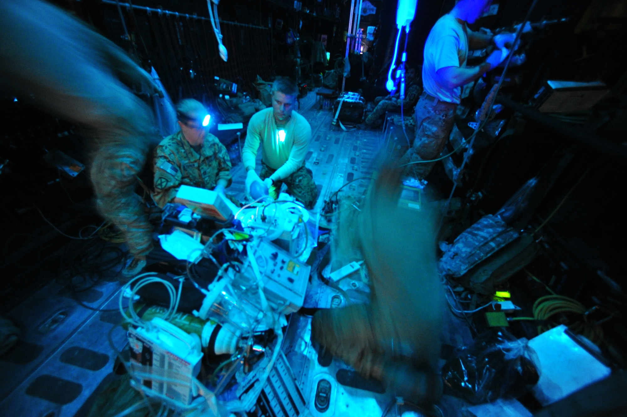 CAMP BASTION, Afghanistan – Airmen and Soldiers assigned to the 76th Expeditionary Rescue Squadron provide critical care to a patient onboard a HC-130 during a medical evacuation. The 76th ERQS serves as an ambulance of the air for Operation ENDURING FREEDOM. The squadron’s mission is to provide medical or casualty evacuation and personnel recovery for U.S. and coalition forces, Afghan National Security Forces and local nationals in all of the regional commands in Afghanistan. (U.S. Air Force photo/Senior Airman Tyler Placie)