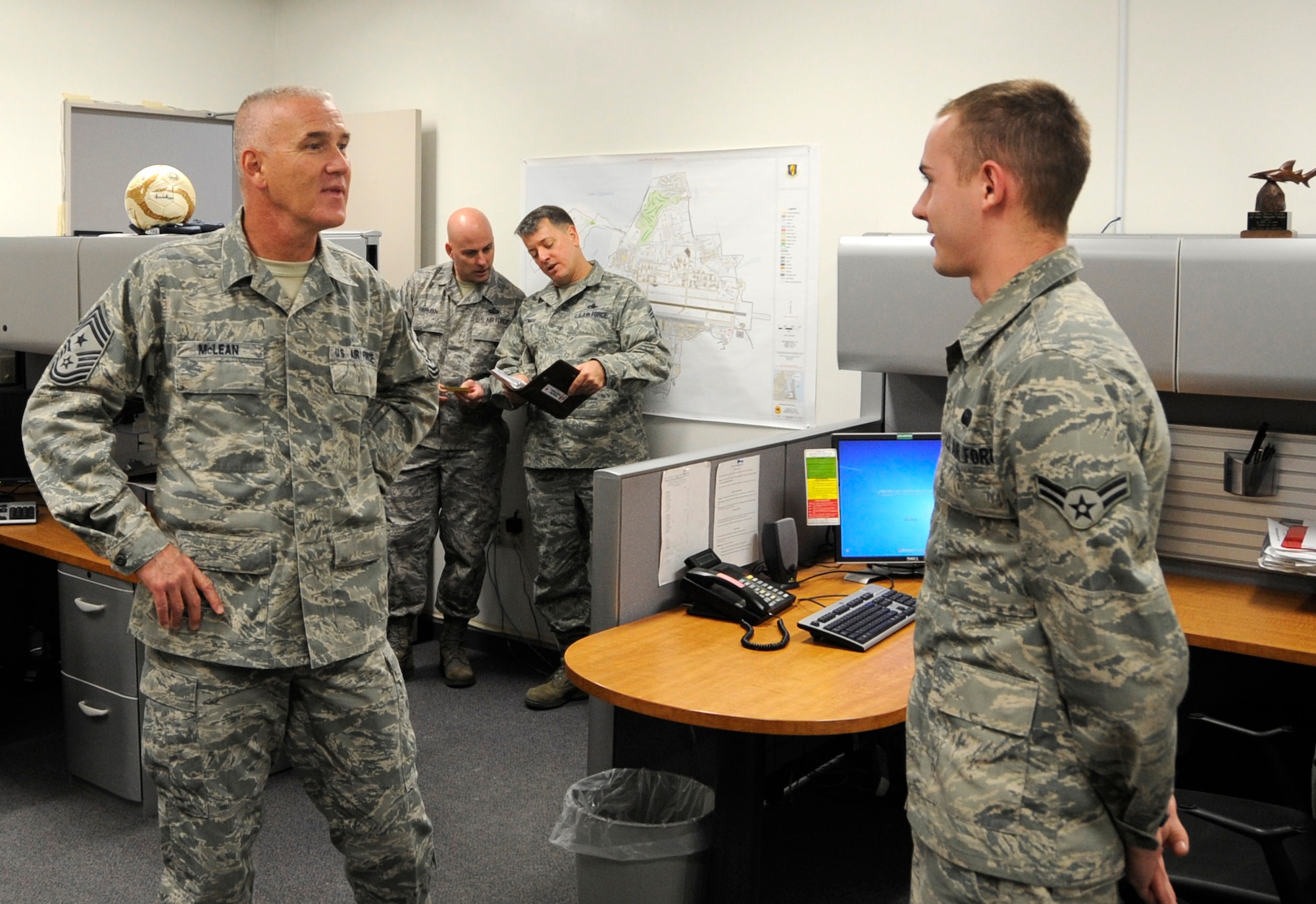 MISAWA AIR BASE, Japan -- Airman 1st Class Harrison Heidelburg, 35th Communication Squadron client system technician, explains the squadron's mission to Chief Master Sgt. Brooke McLean, Pacific Air Forces command chief, here, Jan. 25. During his visit, McLean toured base facilities and discussed hot topics with Airmen such as training and the Air Force budget. (U.S. Air Force photo/Airman 1st Class Kaleb Snay)