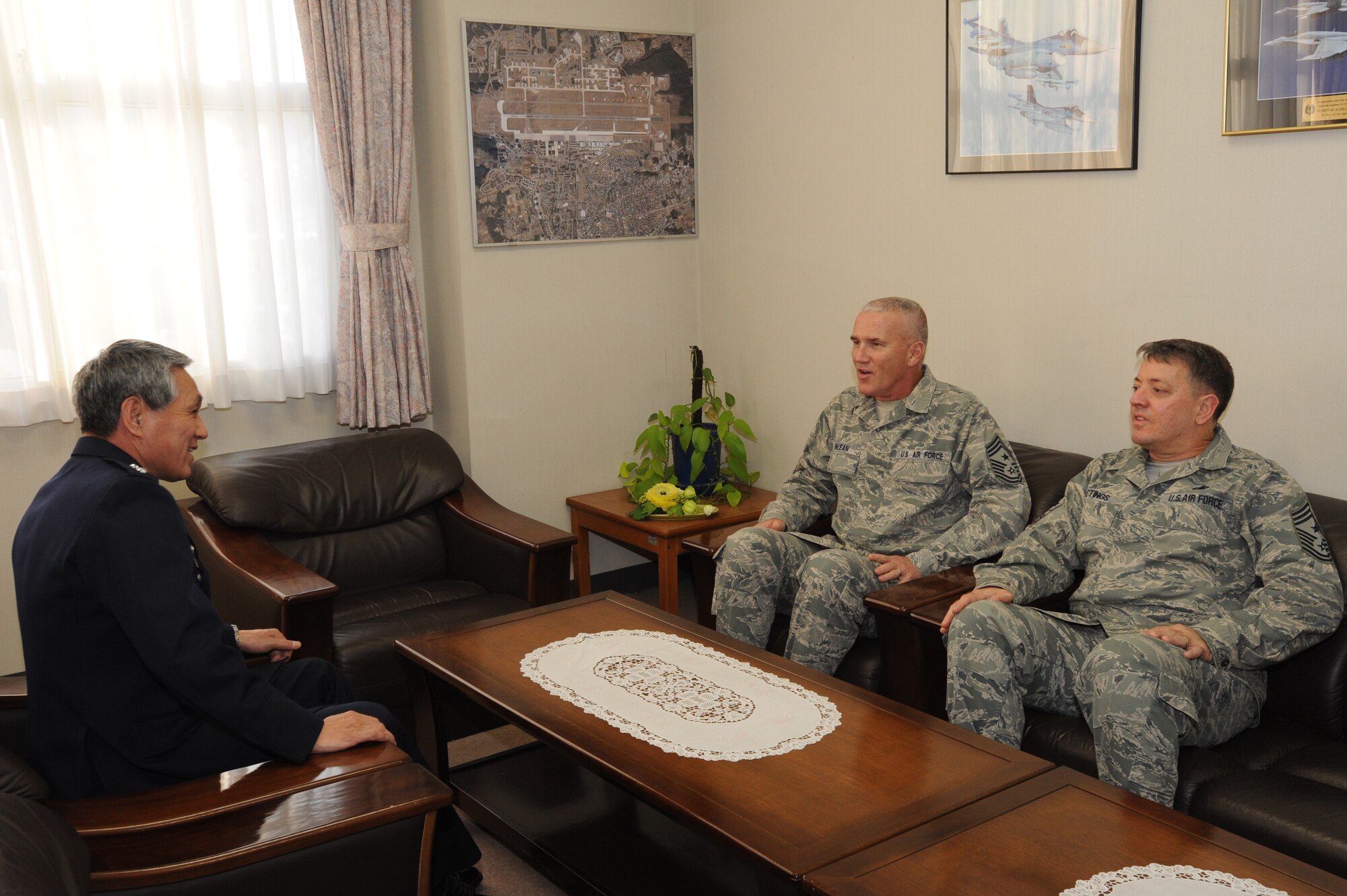 MISAWA AIR BASE, Japan – Maj. Gen. Katsunori Kiyofuji, Japan Air Self-Defense Force 3 rd Air Wing commander, Chief Master Sgt. Brooke McLean, Pacific Air Forces command chief (back) and Chief Master Sgt. Russell Hastings, 35th Fighter Wing command chief (forward) discuss ways to strengthen JASDF and Air Force relationship, Jan. 26. McLean visited Misawa Air Base to guest speak at the Chief Recognition Ceremony and tour various units on base. McLean has an extensive background in logistics. (U.S. Air Force photo/Airman Kenna Jackson)