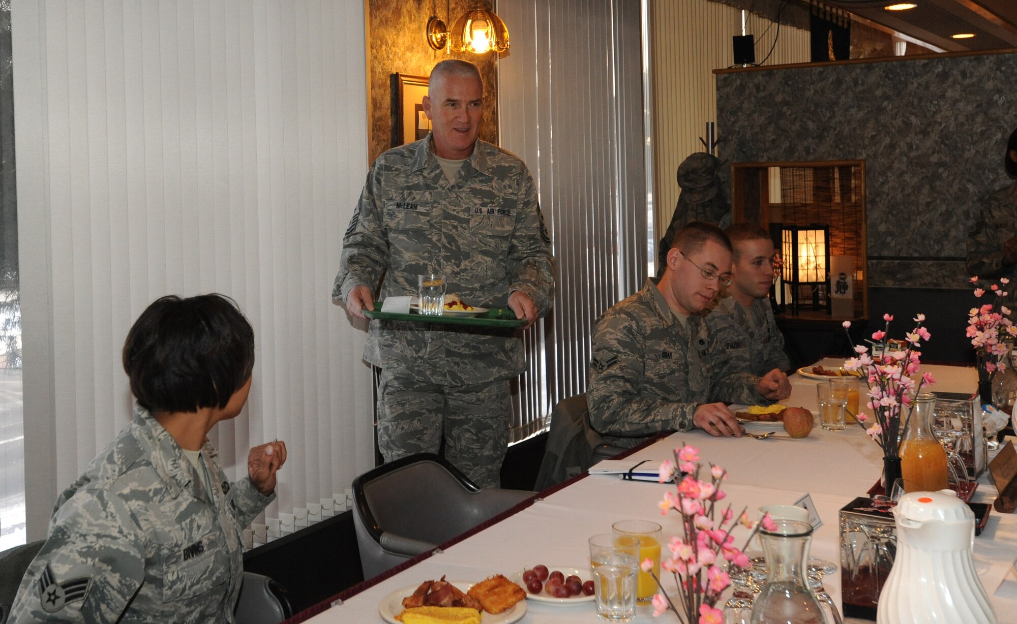MISAWA AIR BASE, Japan – Chief Master Sgt. Brooke McLean, Pacific Air Forces command chief, prepares to eat breakfast with Airmen at the Grissom Dining Facility, Jan. 25. McLean visited Misawa Air Base to guest speak at the Chief Recognition Ceremony and tour various units on base. McLean has an extensive background in logistics. (U.S. Air Force photo/Airman Kenna Jackson)