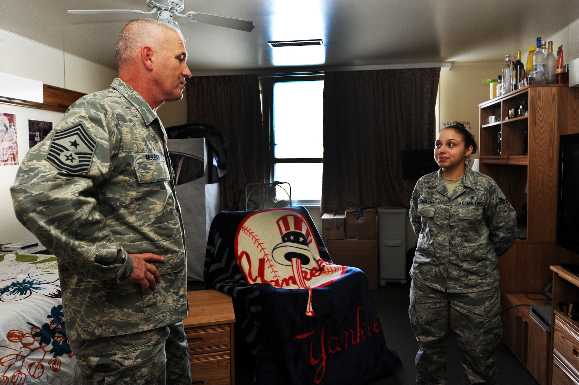 MISAWA AIR BASE, Japan -- Chief Master Sgt. Brooke McLean, Pacific Air Forces command chief, asks Airman 1st Class Nicole Camacho, 35th Medical Support Squadron outpatient records technician, about her dormitory room, here Jan. 25. McLean visited several dormitories to see what kind of conditions Airmen were living in. (U.S. Air Force photo/Airman 1st Class Kia Atkins)