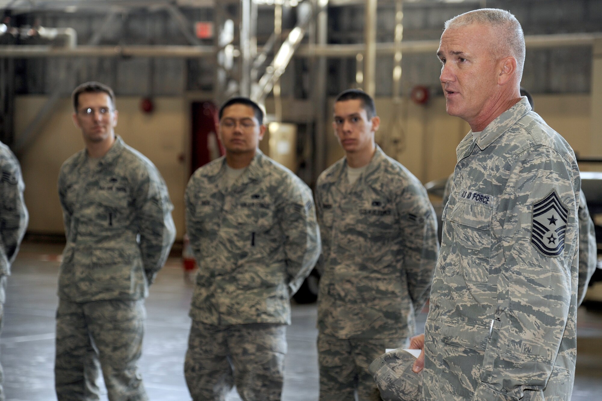 MISAWA AIR BASE, Japan - Chief Master Sgt. Brooke McLean, Pacific Air Forces command chief, talks to Airmen of the 35th Maintenance Group during his visit here, Jan. 25. McLean visited Misawa Air Base to guest speak at the Chief Recognition Ceremony and tour various units on base. (U.S. Air Force photo/Tech. Sgt. Marie Brown)
