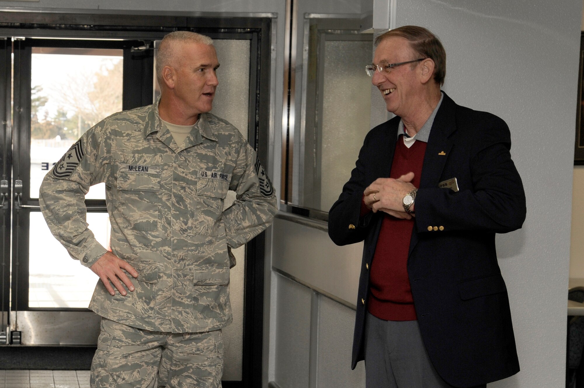 MISAWA AIR BASE, Japan - Chief Master Sgt. Brooke McLean, Pacific Air Forces command chief, talks with Mr. Donald Ohman, Walmsey Bowling Center manager, during his recent visit here, Jan. 25. During his visit, McLean discussed the Air Force's hot topics with Airmen such as money, training and physical fitness. (U.S. Air Force photo/Tech. Sgt. Marie Brown)
