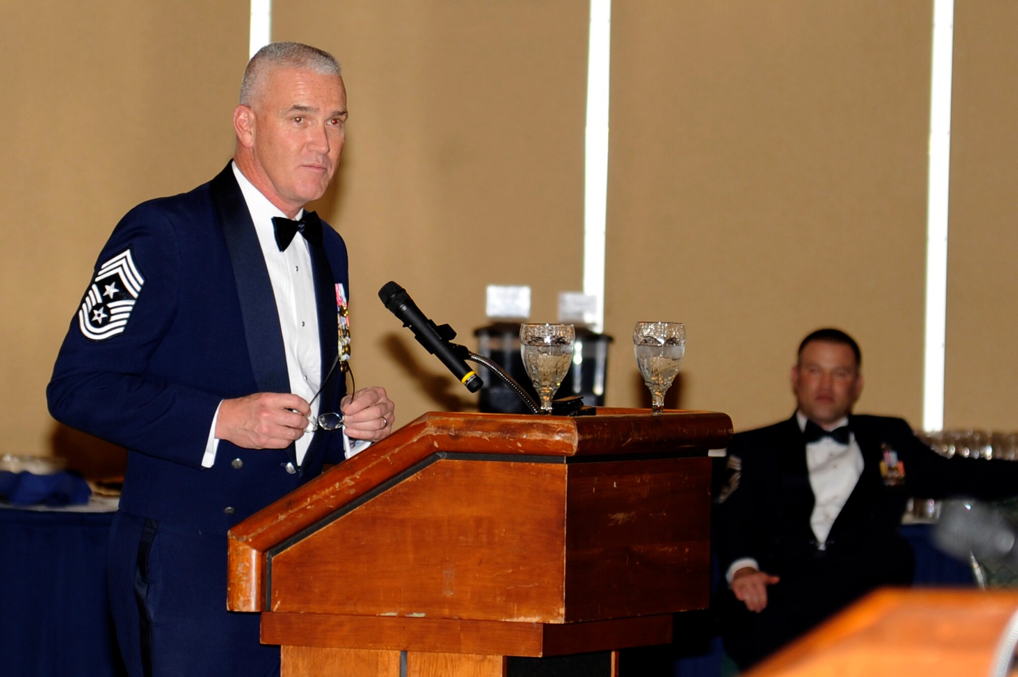MISAWA AIR BASE, Japan - Chief Master Sgt. Brooke McLean, Pacific Air Forces command chief, addresses members of the 35th Fighter Wing and their guests at the Chief Recognition Ceremony here, Jan. 25. McLean visited Misawa to attend the Chief Recognition Ceremony and to discuss with Airmen the Air Force's hot topics such as money, training and resiliency. (U.S. Air Force photo/Tech. Sgt. Marie Brown)