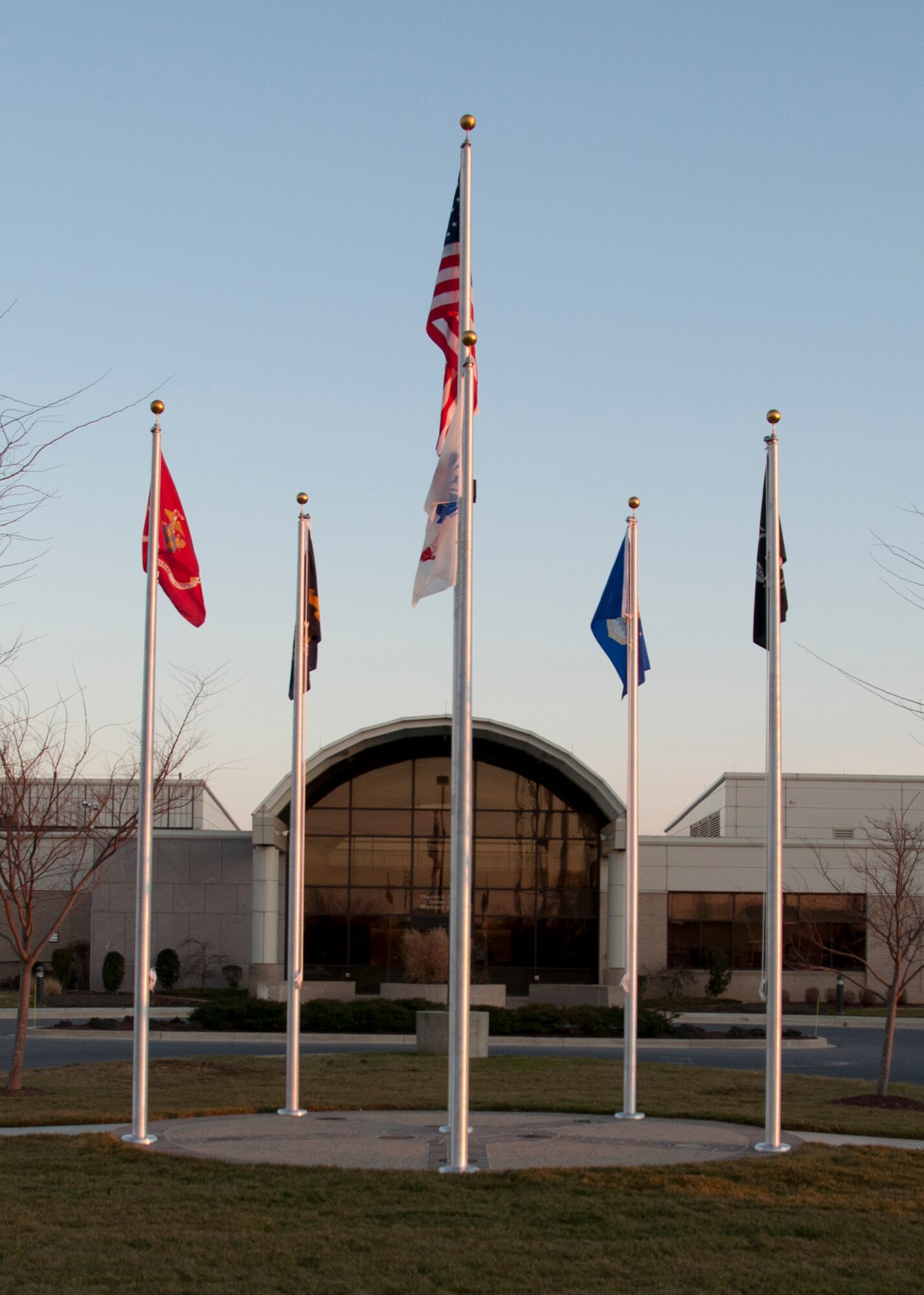The U.S. Flag, a POW Flag and flags from each of the Armed Forces fly at the Memorial Flag Circle in front of the Charles C. Carson Center for Mortuary Affairs at Dover Air Force Base, Del., Jan. 25, 2012. (U.S. Air Force photo/Staff Sgt. James W. Jackson) 
