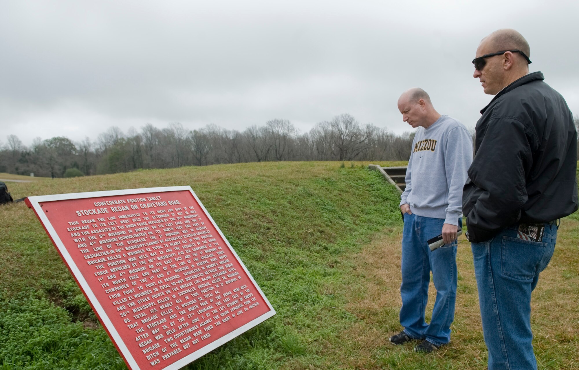 VICKSBURG, Miss. - Senior Master Sgt. Jerry Wilkerson, right, 509th Logistics Readiness Squadron from Whiteman Air Force Base, Mo., and Chief Master Sgt. Terry West, 8th Air Force command chief, read a tablet in Vicksburg, Miss., Jan. 26. Throughout Vicksburg there are color coded position tablets marking certain events and battles that took place during the Civil War. (U.S. Air Force photo/Airman 1st Class Benjamin Gonsier)(RELEASED)

