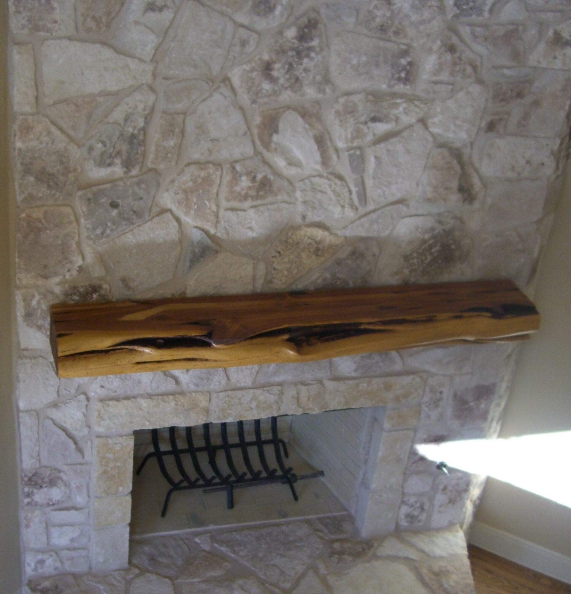 SAN ANTONIO, Texas -- The finished product, a fire place mantle, in the new home of Nancy Carper, an AFCEE subject matter specialist for inegrated waste management. Courtesy photo