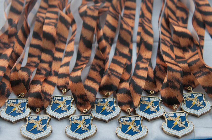 Medallions rest on a table as the commander and 
 Command chief of the 23d Wing present each award nominee with a medallion during the Annual Awards Banquet at the James H. Rainwater Conference Center in Valdosta, Ga., Jan. 28, 2012. There were nearly 100 nominees for the 2012 annual awards. (U.S. Air Force Photo by Airmen 1st Class Paul Francis/Released)
