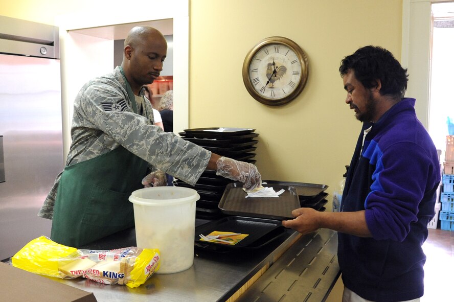 Staff Sgt. Willie Baker earned the title of 4th Fighter Wing 2011 Volunteer of the Year during a ceremony at Seymour Johnson Air Force Base, N.C., Jan. 28, 2012. Baker is assigned to the 4th Fighter Wing Command Post. (U.S. Air Force photo/Senior Airman Whitney Stanfield)