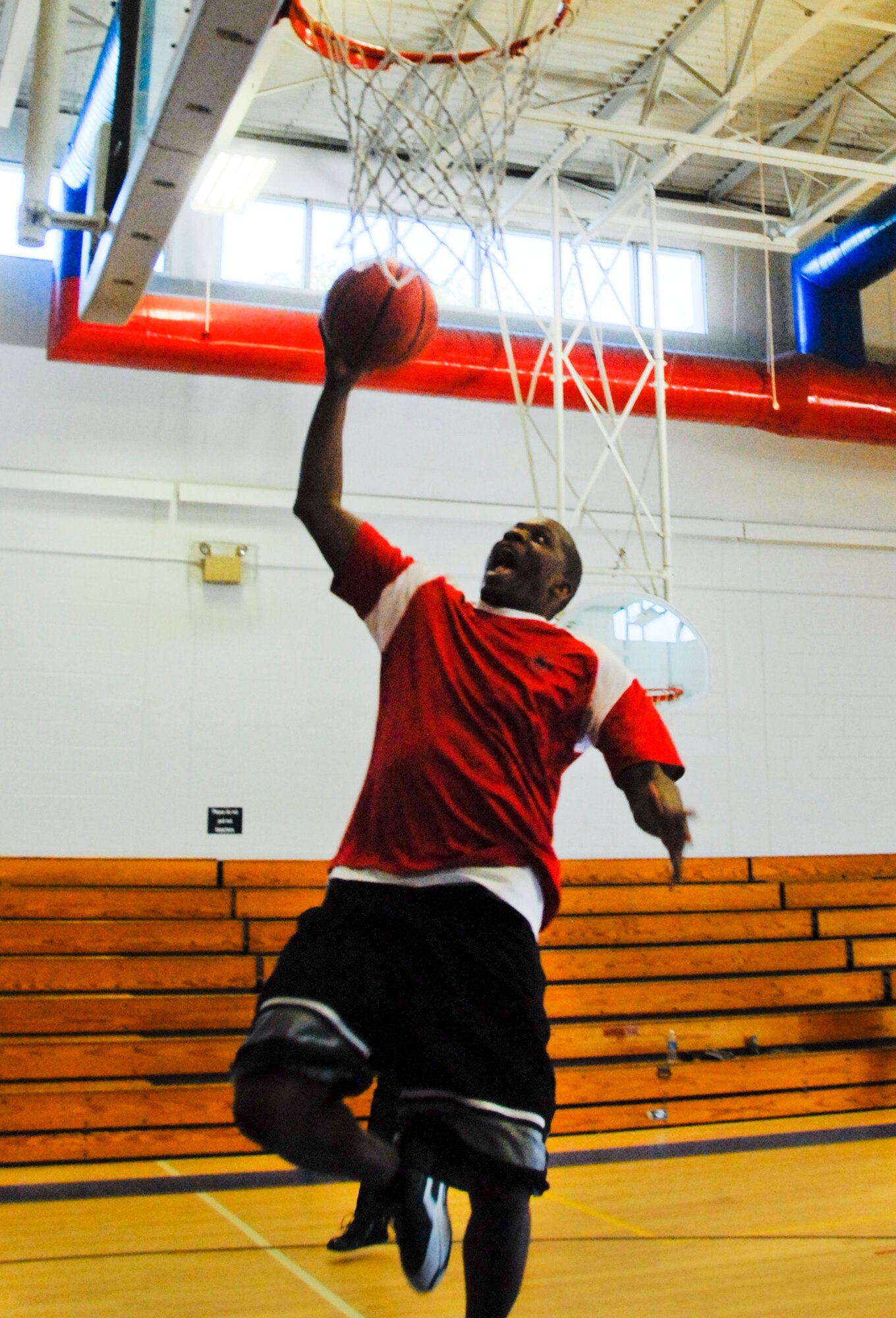 Curtis Palmer, a member of the Chiefs’ basketball team, goes for a lay-up in the annual Eagles versus Chiefs basketball game Jan. 27.  The Eagles won for the second straight year, 50-40. (U.S. Air Force photo/Kevin Gaddie)