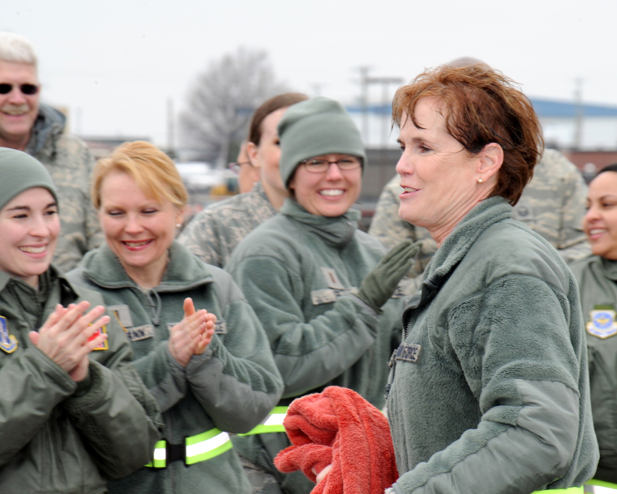 Col. Jacqueline Nave, right, is congratulated after her final flight by her fellow Tennessee Air National Guardsmen. (Photo by: Tech. Sgt. Robin Olsen, Tenn. National Guard Joint Force Headquarters Public Affairs.)