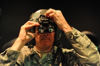 Captain Ronny Bowman, 81st Aerospace Medicine Squadron commander,  aligns his night vision goggles during a NVG Academic Instructors Course held at the Aerospace Physiology building on Joint Base San Antonio-Randolph Jan. 25. (U.S. Air Force photo/Rich McFadden) (released)