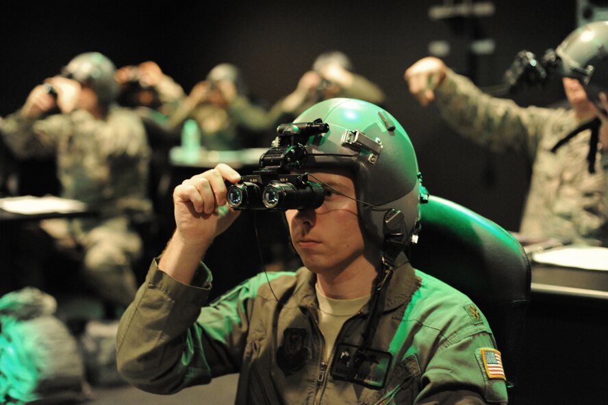 Major Kris Ostrowski, 27th Special Operations Support Squadron aerospace and operational physiology chief,  aligns his night vision goggles during a NVG Academic Instructors Course held at the Aerospace Physiology building on Joint Base San Antonio-Randolph Jan. 25. (U.S. Air Force photo/Rich McFadden) (released)