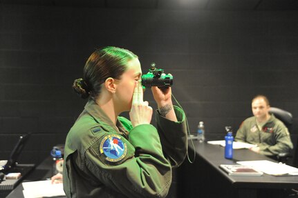 Lt. Shannon Scannon, 359th Aerospace Medicine Squadron OIC of academics and training, demonstrates how to align night vision goggles during a NVG Academic Instructors Course held at the Aerospace Physiology building on Joint Base San Antonio-Randolph Jan. 25. (U.S. Air Force photo/Rich McFadden) (released)