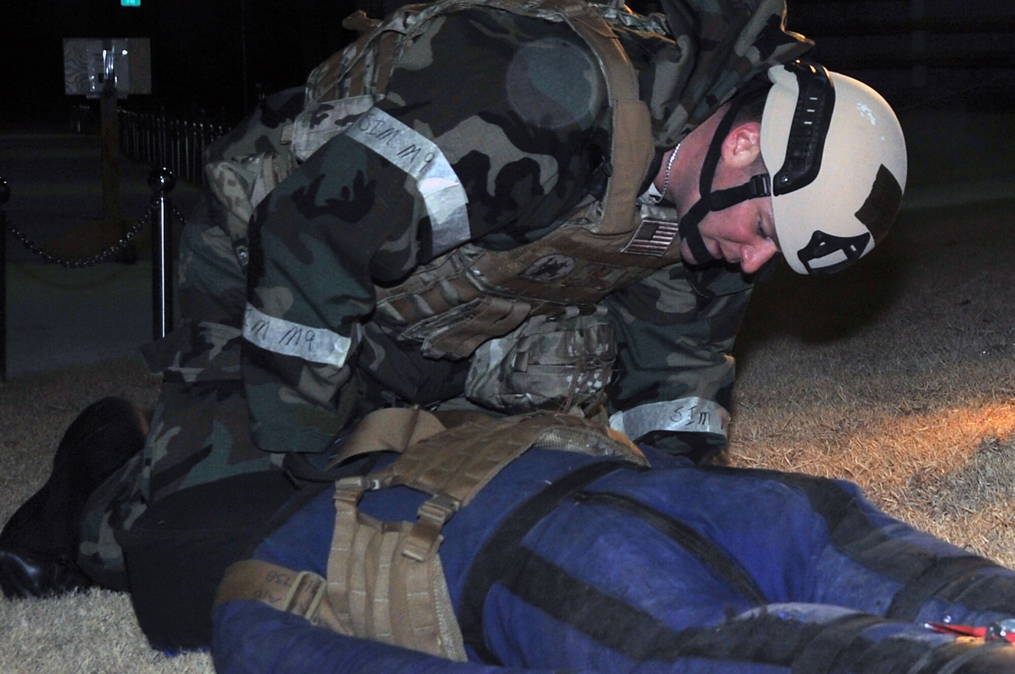 Staff Sgt. Daniel Rosemier, 51st Civil Engineer Squadron, examines a vest containing an improvised explosive device, Jan. 30, 2012. The Airmen are participating in a peninsula-wide operational readiness exercise, Beverly Bulldog 12-01, held to train U.S. forces throughout South Korea. (U.S. Air Force photo/Staff Sgt. Craig R. Cisek)