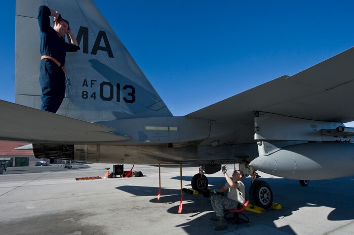 U.S. Air Force Airmen, 104th Fighter Wing, Massachusetts Air National Guard, finish a post-flight inspection of an F-15E Strike Eagle during Red Flag 12-2 Jan. 24, 2012, at Nellis Air Force Base, Nev. Red Flag is a realistic combat training exercise involving the air forces of the United States and its allies. The exercise includes units from Nevada, Colorado, South Dakota, Louisiana, Utah, California, Republic of Korea, Kingdom of Saudi Arabia, Massachusetts and Oklahoma. (U.S. Air Force photo by Airman 1st Class Daniel Hughes)