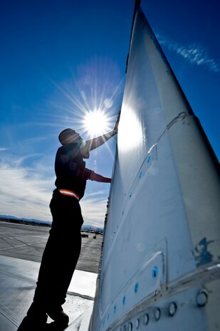 U.S. Air Force Senior Airman Bryan Burke, 104th Fighter Wing crew chief, Massachusetts Air National Guard, conducts a post flight inspection on an F-15E Strike Eagle during Red Flag 12-2 Jan. 24, 2012, at Nellis Air Force Base, Nev. Red Flag is a realistic combat training exercise involving the air forces of the United States and its allies. The exercise includes units from Nevada, Colorado, South Dakota, Louisiana, Utah, California, Republic of Korea, Kingdom of Saudi Arabia, Massachusetts and Oklahoma. (U.S. Air Force photo by Airman 1st Class Daniel Hughes)