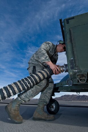 U.S. Air Force Staff Sgt. Sean Dowd, 104th Fighter Wing, Massachusetts Air National Guard, conducts pre-flight maintenance on an F-15 E Strike Eagle during Red Flag 12-2 Jan. 24, 2012, at Nellis Air Force Base, Nev. Red Flag is a realistic combat training exercise involving the air forces of the United States and its allies. The exercise includes units from Nevada, Colorado, South Dakota, Louisiana, Utah, California, Republic of Korea, Kingdom of Saudi Arabia, Massachusetts and Oklahoma. (U.S. Air Force photo by Airman 1st Class Daniel Hughes)