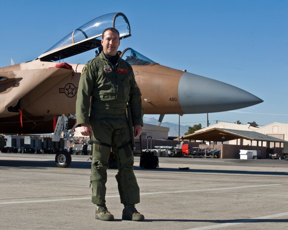 U.S. Air Force Lt. Col. James Leffel, 57th Adversary Tactics Support Squadron commander and pilot, stands in front of an F-15C Eagle after returning from a temporary deployment Jan. 13, 2012, at Nellis Air Force Base, Nev. Leffel surpassed a notable mark in the world of flying the F-15C Eagle by accumulating more than 2,000 hours in the aircraft.  He compiled these hours during tours at the following locations: Tyndall AFB, Fla.; Kadena AB, Okinawa; Elmendorf AFB, Alaska and Nellis AFB, Nev. (U.S. Air Force photo by Airman 1st Class Daniel Hughes)